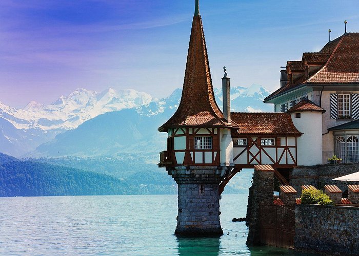 Oberhofen Castle The Oberhofen castle, with its tower on the water, lies on the ... photo