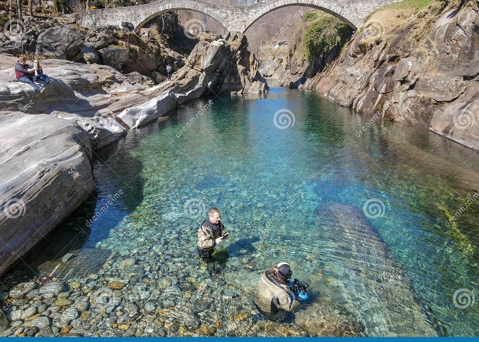 Lavertezzo Roman Bridge Tourists Visiting the Famous Roman Bridge of Lavertezzo on ... photo