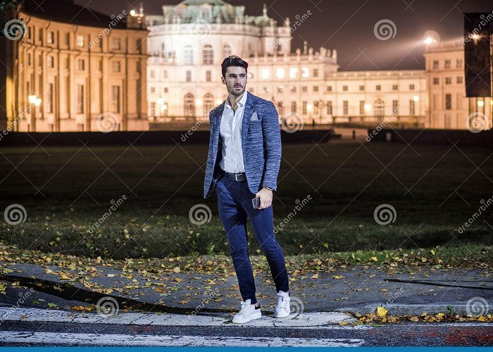 Stupinigi Palace & Park Photo of a Man Standing on the Side of a Street Stock Photo ... photo