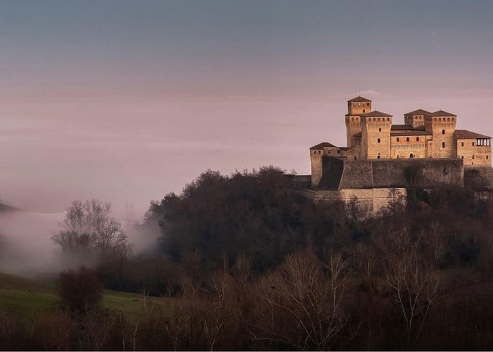 Castle of Torrechiara Torrechiara castle in the fog, Langhirano, Emilia Romagna, Italy ... photo