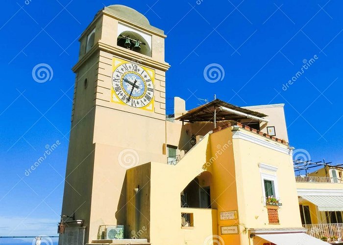 Piazza Umberto I Capri, Italy - May 04, 2014: Clocktower on Piazza Umberto I ... photo