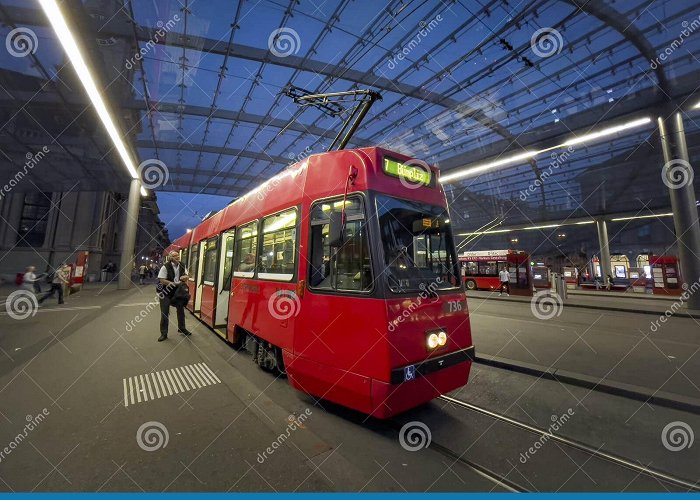 Bern Railway Station Red Tram at the Covered Stop at the Bern Railway Station ... photo