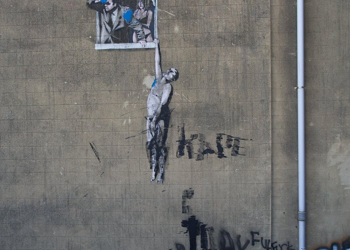 Well Hung Lover Graffiti Rival graffiti artists attack Banksy's 'Well Hung Lover' for the ... photo
